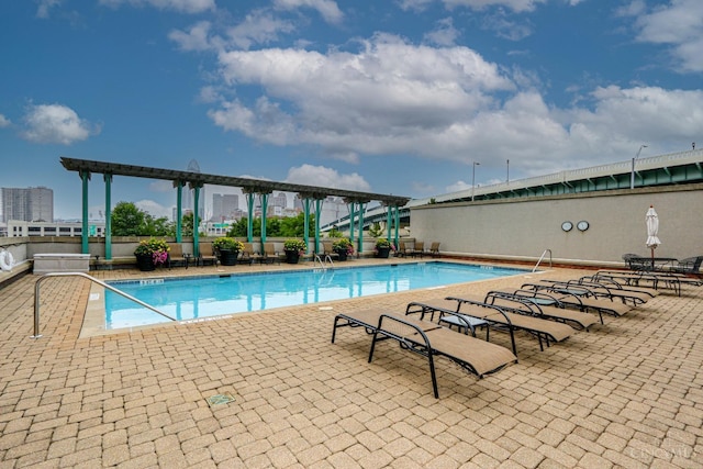 community pool featuring a patio area