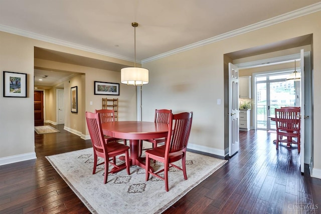 dining room with baseboards, dark wood-style flooring, and ornamental molding