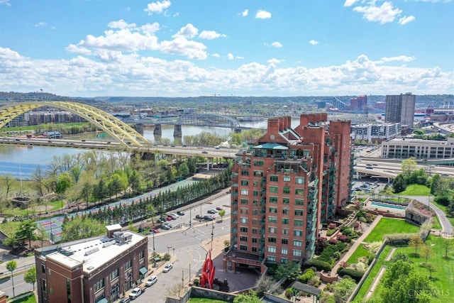 view of urban area featuring a notable bridge and a nearby body of water