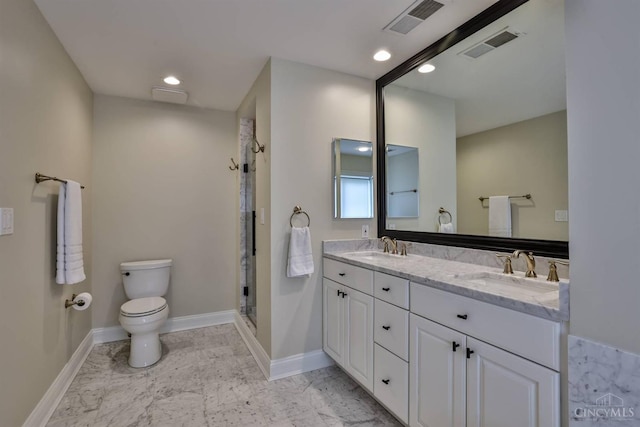 full bathroom with toilet, a stall shower, marble finish flooring, double vanity, and recessed lighting