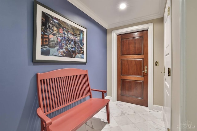 doorway featuring marble finish floors, ornamental molding, and baseboards