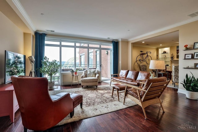 living area featuring ornamental molding and dark wood-style floors
