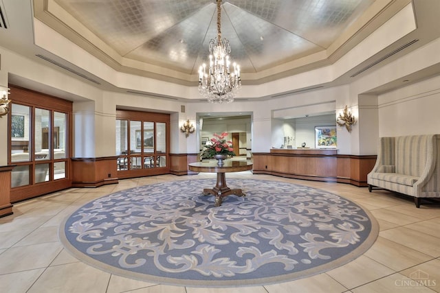 building lobby featuring a wainscoted wall