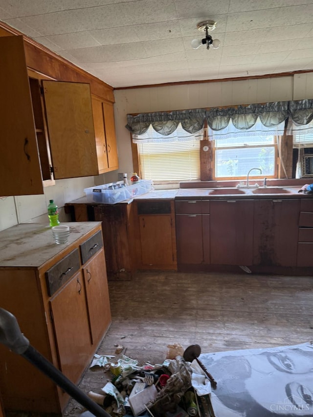 kitchen with brown cabinets and a sink