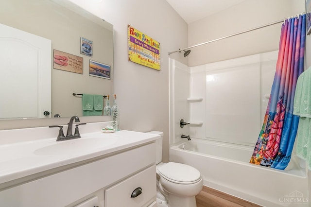 bathroom featuring vanity, shower / tub combo, toilet, and wood finished floors