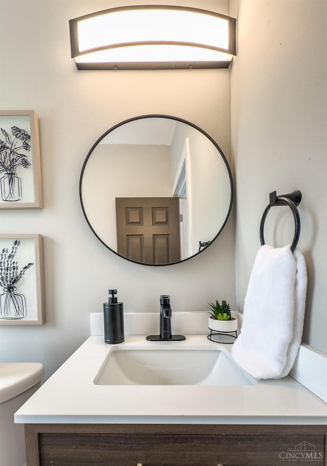 bathroom with vanity and toilet