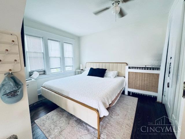 2848 Markbreit Ave, Cincinnati, OH 45209 - bedroom featuring dark wood-type flooring, radiator heating unit, and a ceiling fan