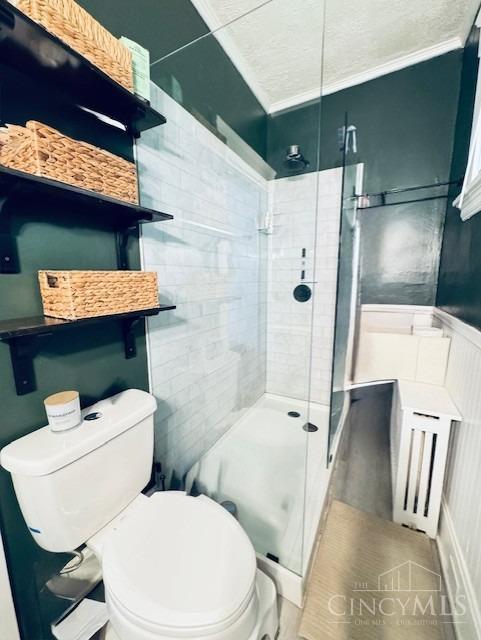 2848 Markbreit Ave, Cincinnati, OH 45209 - full bath featuring ornamental molding, toilet, and a stall shower