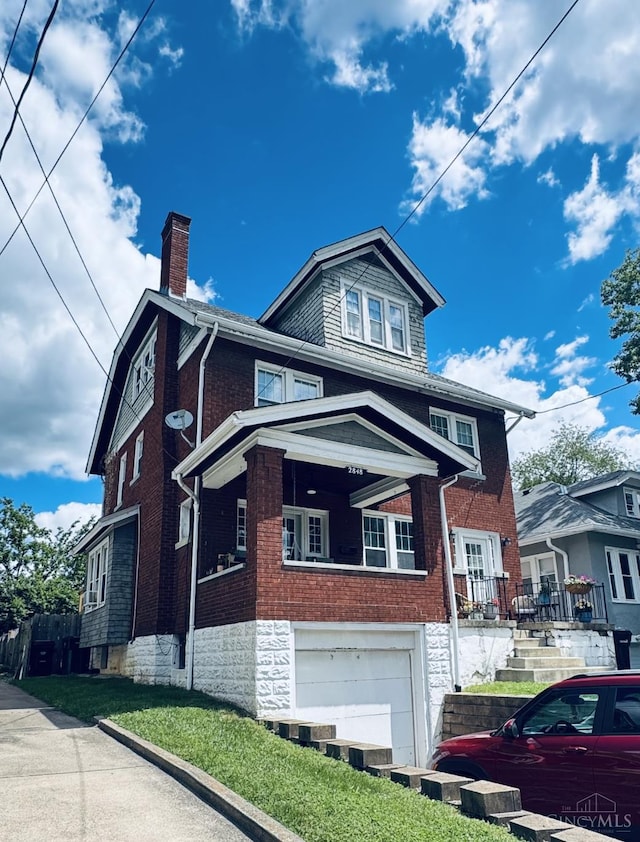 2848 Markbreit Ave, Cincinnati, OH 45209 - view of front of home with a chimney, an attached garage, and brick siding