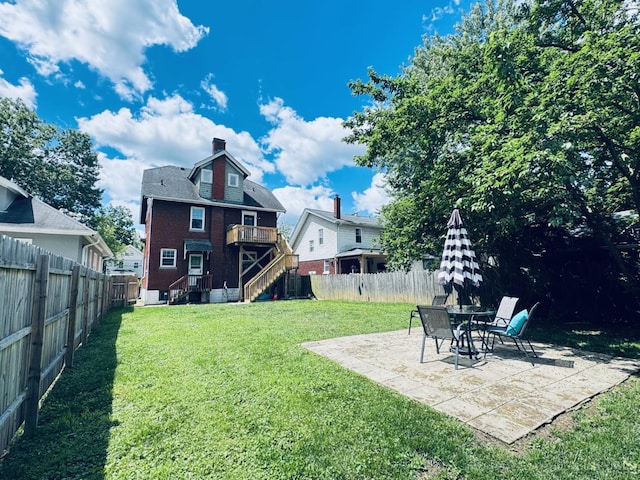 2848 Markbreit Ave, Cincinnati, OH 45209 - back of house with a chimney, a patio, and brick siding