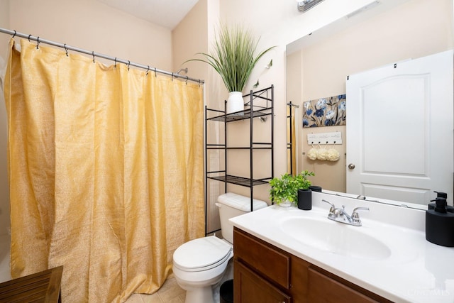 bathroom featuring toilet, vanity, and a shower with shower curtain