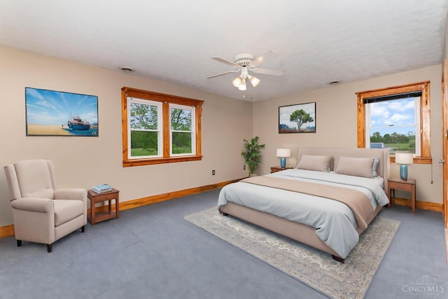 bedroom with light carpet, baseboards, and a ceiling fan