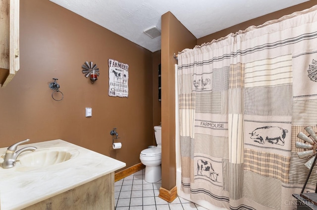 bathroom with toilet, tile patterned floors, visible vents, baseboards, and vanity