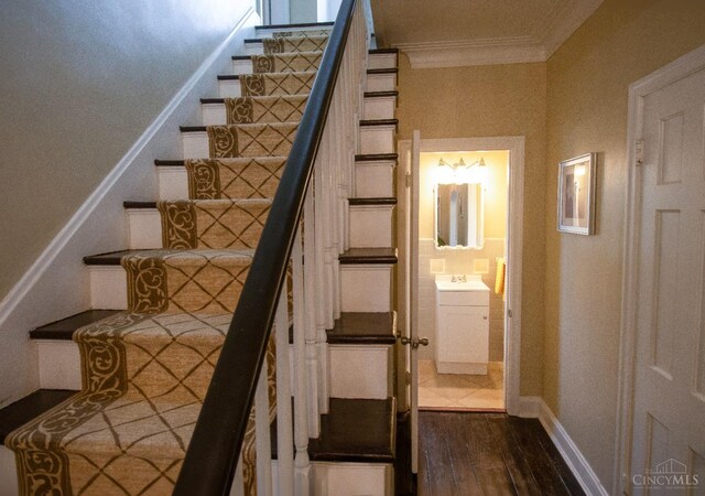 1103 Towanda Ter, Cincinnati, OH 45216 - stairway featuring baseboards, crown molding, and wood finished floors