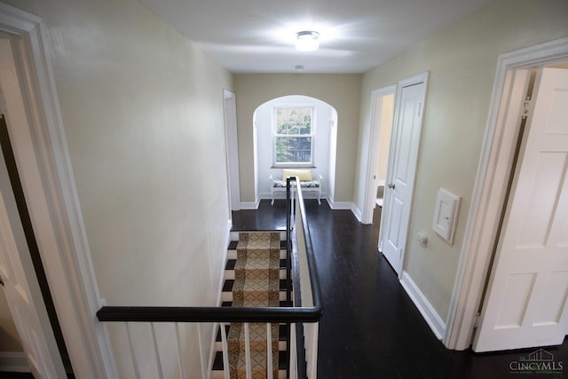 1103 Towanda Ter, Cincinnati, OH 45216 - corridor with dark wood-style flooring, arched walkways, and baseboards