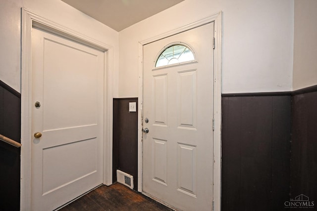 6014 Argus Rd, Cincinnati, OH 45224 - foyer entrance featuring dark wood-style floors and a wainscoted wall
