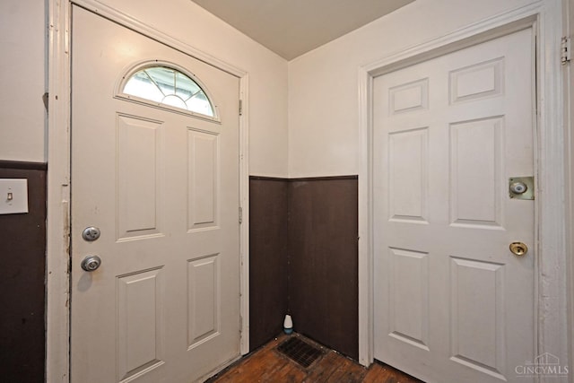 6014 Argus Rd, Cincinnati, OH 45224 - entryway with dark wood-style flooring and wainscoting
