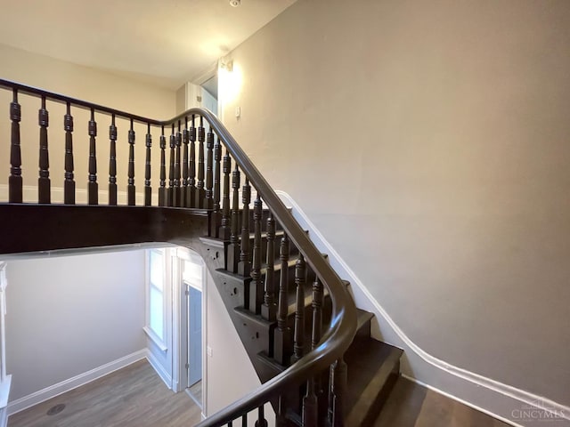 2259 Loth St, Cincinnati, OH 45219 - stairs featuring wood finished floors and baseboards