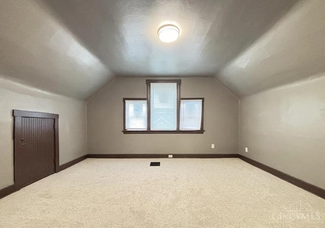 1239 Sliker Ave, Cincinnati, OH 45205 - additional living space featuring carpet floors, vaulted ceiling, and baseboards
