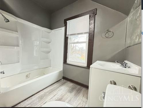 1239 Sliker Ave, Cincinnati, OH 45205 - bathroom with wood finished floors and washtub / shower combination