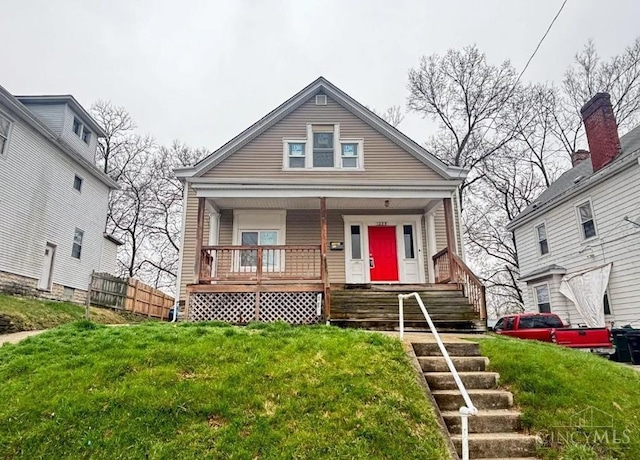 1239 Sliker Ave, Cincinnati, OH 45205 - view of front of property featuring a porch and a front yard