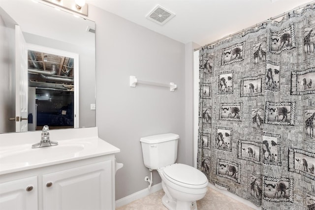 full bath with toilet, vanity, and tile patterned floors
