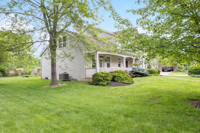 view of front of property with cooling unit, a front lawn, and a porch