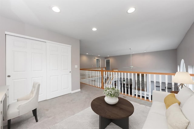 living area featuring carpet flooring, recessed lighting, and ceiling fan