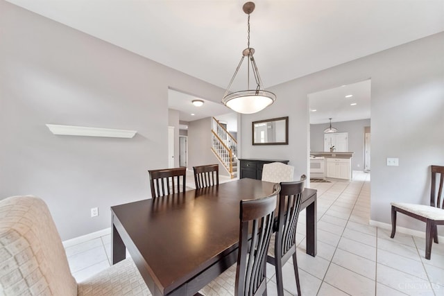 dining room featuring stairs, baseboards, light tile patterned flooring, and recessed lighting
