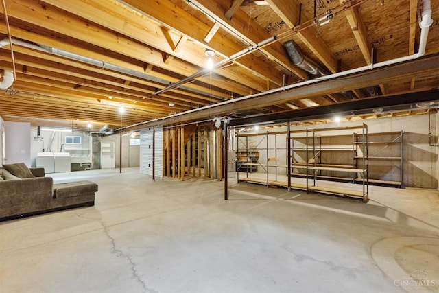 basement featuring washing machine and clothes dryer