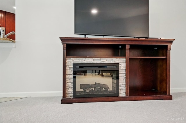 detailed view of carpet floors, baseboards, a fireplace, and recessed lighting