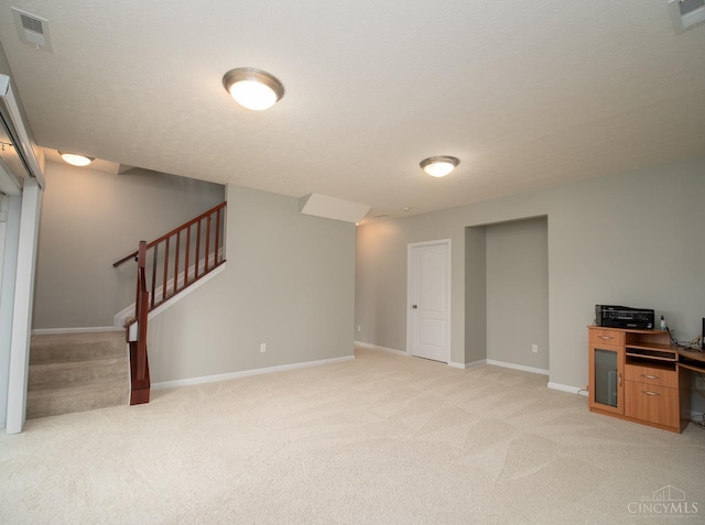 9413 Stoneybrooke, Springfield Twp, OH 45231 - below grade area with light colored carpet, baseboards, and stairway