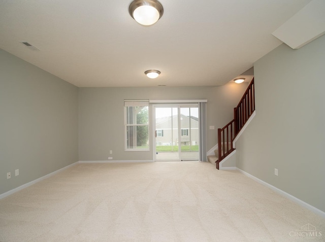9413 Stoneybrooke, Springfield Twp, OH 45231 - unfurnished room featuring stairway, baseboards, and light carpet