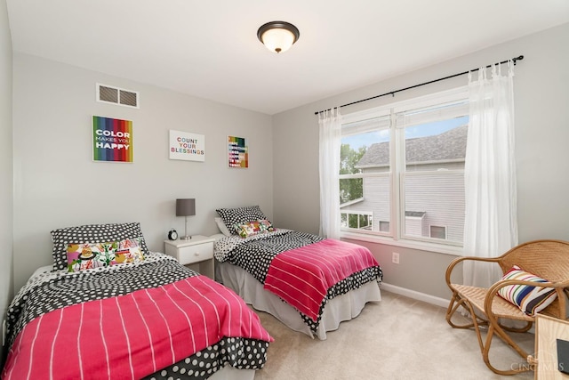 carpeted bedroom featuring baseboards