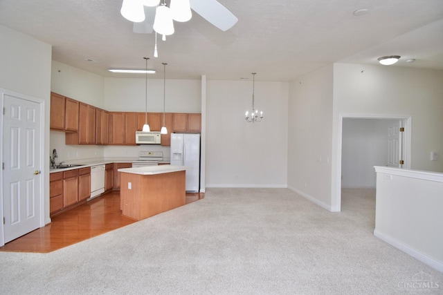 6720 Kelseys Oak Ct, Green Twp, OH 45248 - kitchen featuring white appliances, light colored carpet, a sink, a center island, and ceiling fan