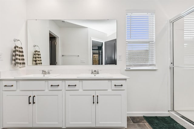 1750 Parkfield Way, Goshen Twp, OH 45122 - bathroom featuring baseboards, double vanity, and a shower stall