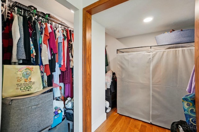 11675 New Biddinger Rd, Harrison Twp, OH 45030 - full bathroom with wood finished floors and a shower with curtain