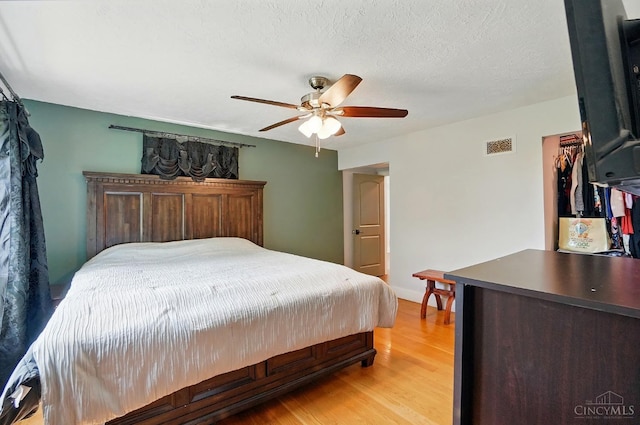 11675 New Biddinger Rd, Harrison Twp, OH 45030 - bedroom with light wood-type flooring and a ceiling fan