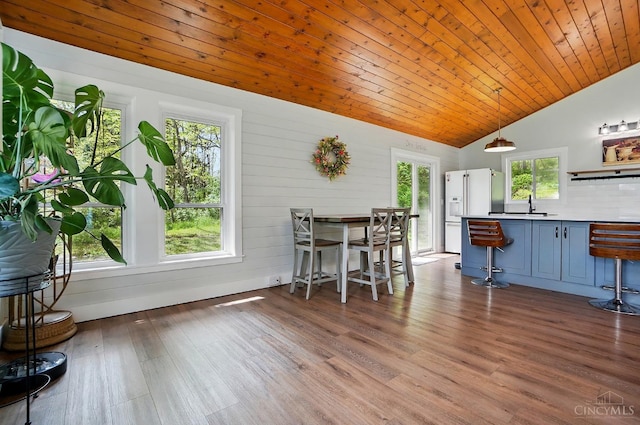 11675 New Biddinger Rd, Harrison Twp, OH 45030 - dining room with lofted ceiling, healthy amount of natural light, wood finished floors, and wooden ceiling