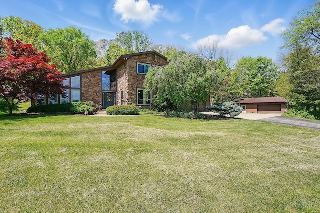 11675 New Biddinger Rd, Harrison Twp, OH 45030 - view of front of property with stone siding, a front lawn, a garage, and asphalt driveway