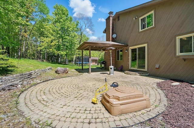 11675 New Biddinger Rd, Harrison Twp, OH 45030 - view of patio with a trampoline