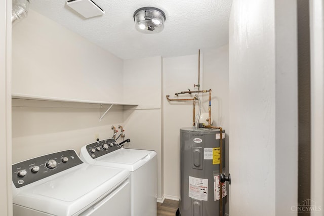 laundry room with electric water heater, independent washer and dryer, a textured ceiling, and dark wood finished floors