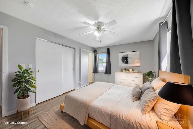 2774 N Law Rd, Reily Twp, OH 45056 - bedroom featuring wood finished floors, baseboards, and a ceiling fan