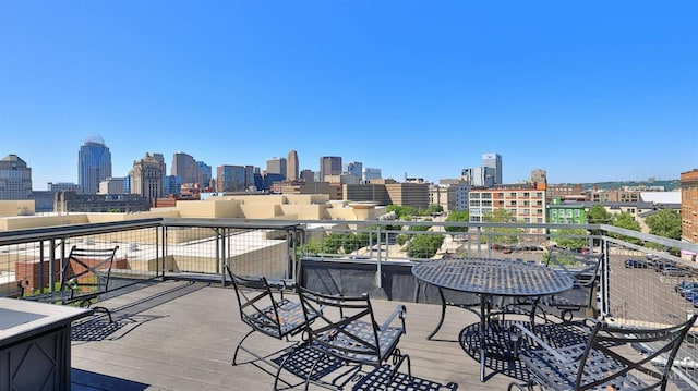 balcony featuring a skyline view