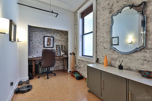 office area with ornamental molding, plenty of natural light, and baseboards