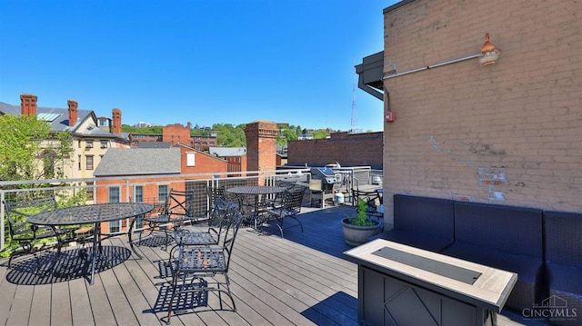 deck featuring outdoor dining space and an outdoor living space