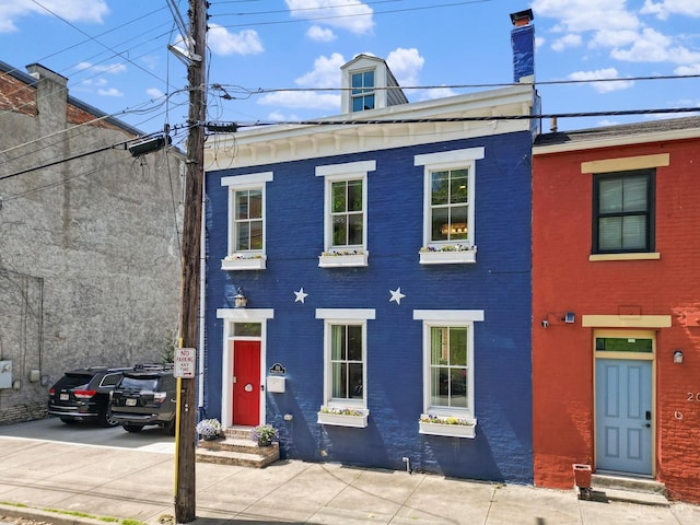 multi unit property with brick siding and entry steps