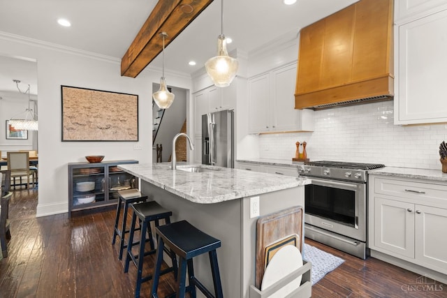 kitchen featuring premium appliances, custom range hood, a sink, dark wood finished floors, and ornamental molding