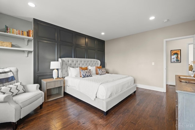 bedroom featuring baseboards, dark wood-type flooring, and recessed lighting