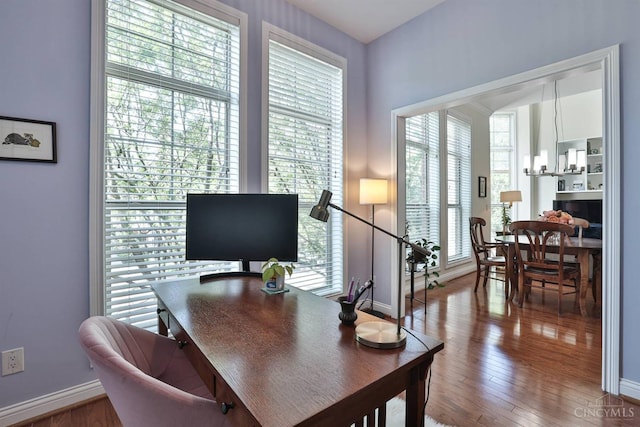 office area featuring baseboards and wood finished floors